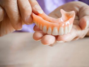 featured image for why are my dentures falling out
